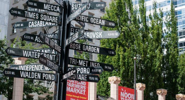PORTLAND, OR - JULY 24  - Geographical distance signage on display outside Farmers Market on July 24, 2011 in Portland, OR.