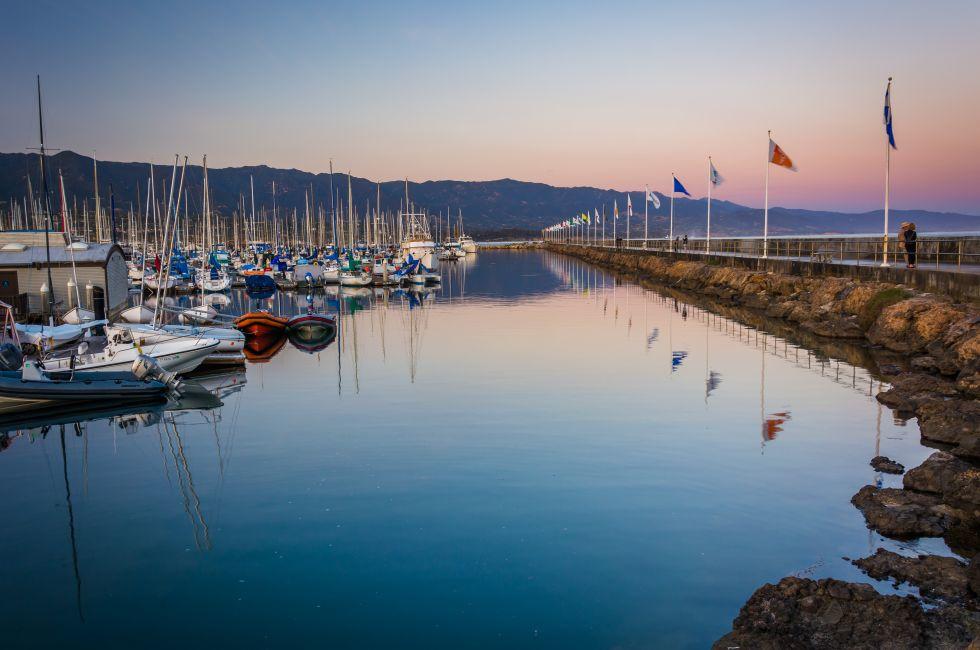Breakwater and boats at the harbor at sunset, in Santa Barbara, California.