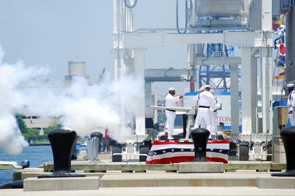 NORFOLK,VA-JUNE 11 2010- Harborfest Parade of Sails,naval soldiers firing gun to solute the boats ,Norfolk Virginia June 11-13 2010.