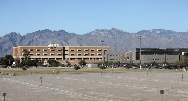 TUCSON, AZ - NOVEMBER 25, 2014: The University of Arizona Medical Center against Santa Catalina mountain range and blue sky as seen from south side.
