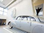 Munich, Germany - January 03 2016: Old white car on the exhibition in Pinakothek der Moderne museum, situated in the city centre of Munich.