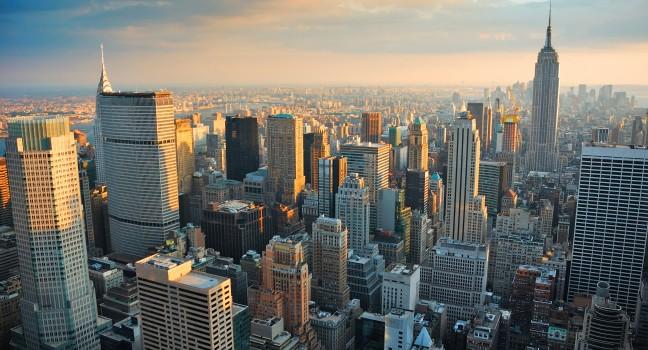 New York City Manhattan skyline aerial view with Empire State and skyscrapers at sunset.