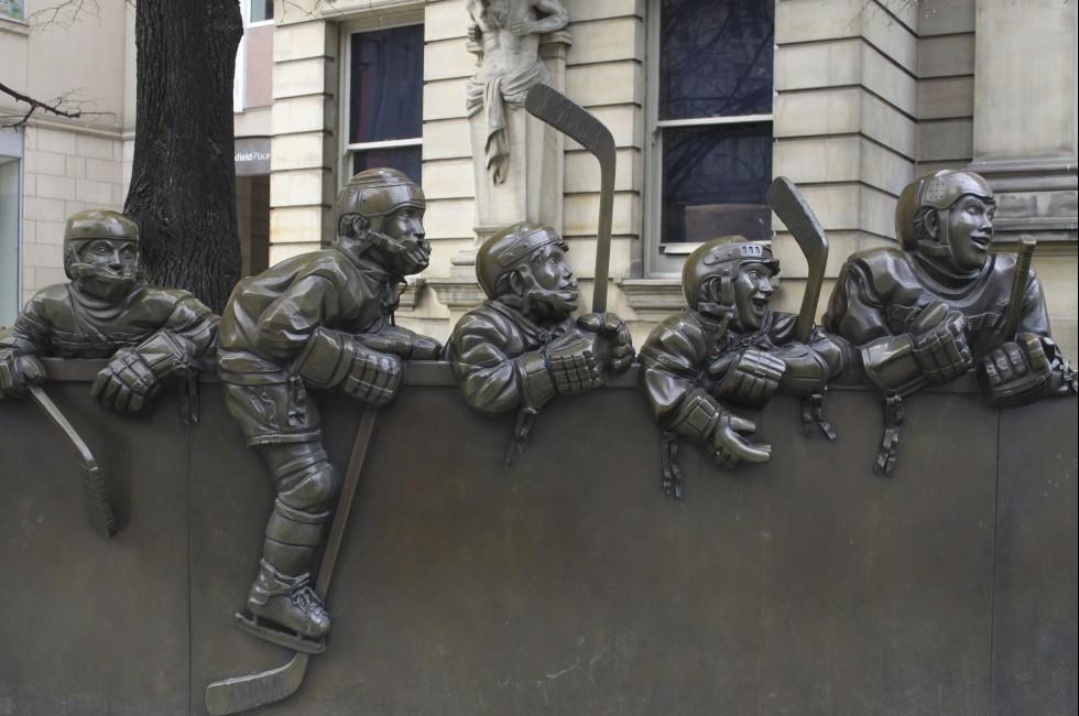 TORONTO - APRIL 22: Bronze sculpture entitled 'our game' by Ontario artist Edie Parker, located outside the Hockey Hall of Fame on April 22 2012 in Toronto, Canada.;