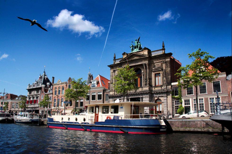 HAARLEM - MAY 3: Historical houses along a canal in old Haarlem on May 3, 2014, Haarlem, The Netherlands.; 