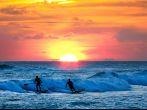 Sunset Surfer at sunset on Resort Beach of Kauai Hawaii