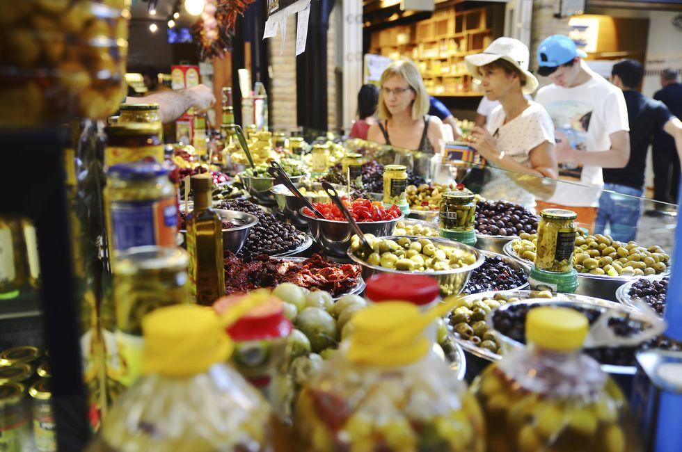 Assortment of marinated olives on stall in Sarona Gastro Market, Tel Aviv, Israel. Recently open Sarona Market became the most popular place in Tel Aviv. 29/7/2016.