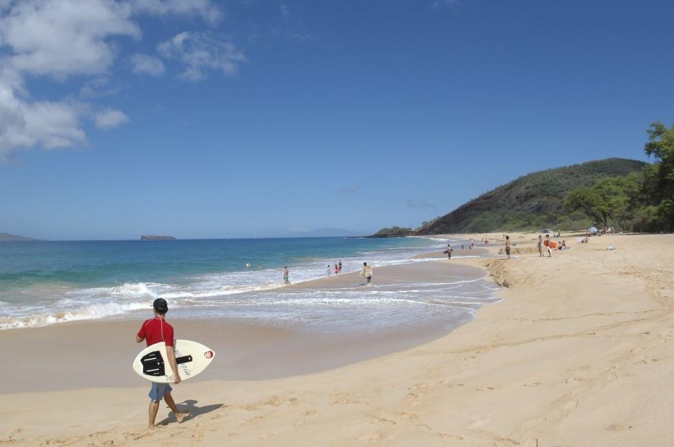 Beach goers enjoying a typical beautiful day on Maui, Hawaii.