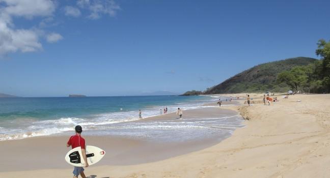 Beach goers enjoying a typical beautiful day on Maui, Hawaii.