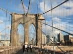 Tourists and residents of New York on Brooklyn Bridge