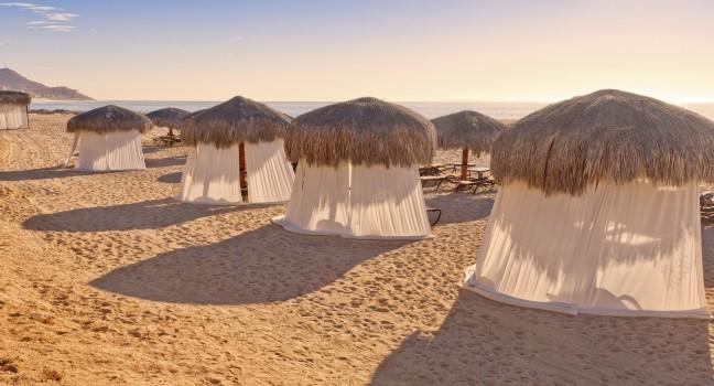 Tiki Huts and Massage Tents on Beach.