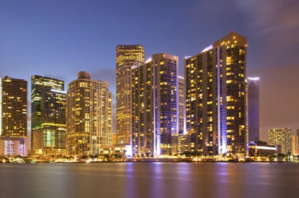 City of Miami Florida, colorful night panorama of downtown business and residential buildings.