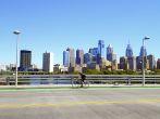 Philadelphia, PA, USA – August 28, 2014: Bicyclist on the South Street Bridge with the Philadelphia Skyline behind him.
