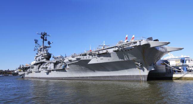 NEW YORK CITY - NOV 2: Intrepid museum at Hudson shore on November 2, 2010 in Manhattan, New York City. USS Intrepid is one of 24 Essex-class aircraft carriers built during WWII for the US Navy.; Shutterstock ID 106415465; Project/Title: MB_NYPhotoMap
