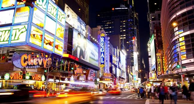Times Square, famous tourist attraction featured with Broadway Theaters and famous restaurant and store locations in New York City, June 3, 2012 in Manhattan, New York City.
