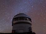 Star observatory in Hawaii at night with Milky Way.
