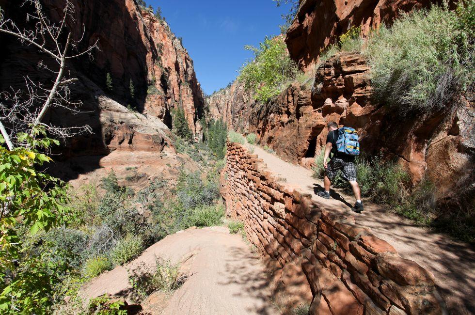 Male hiker on Angels Landing trail in Zion National Park, Utah.