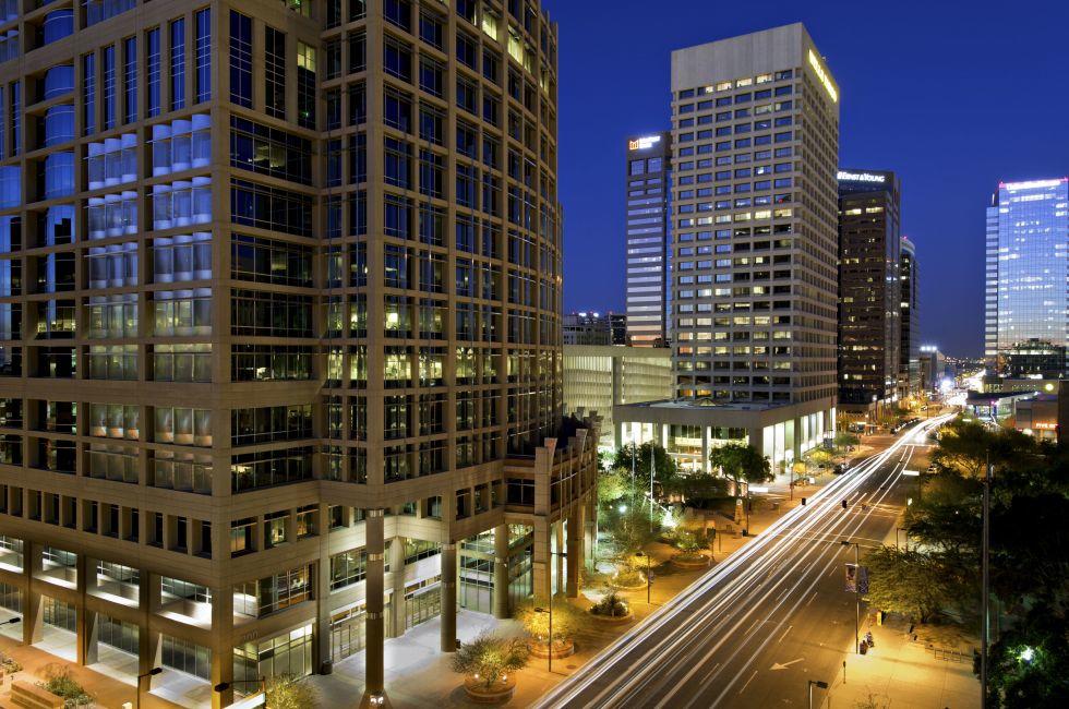 Long exposure photo of the a city street in downtown Phoenix, Arizona at night. 