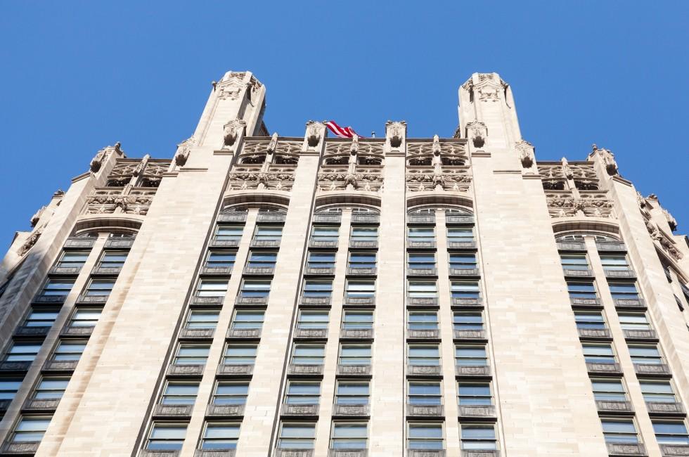 Top of Tribune Tower in Chicago in perspective shot taken from below.