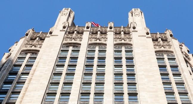 Top of Tribune Tower in Chicago in perspective shot taken from below.