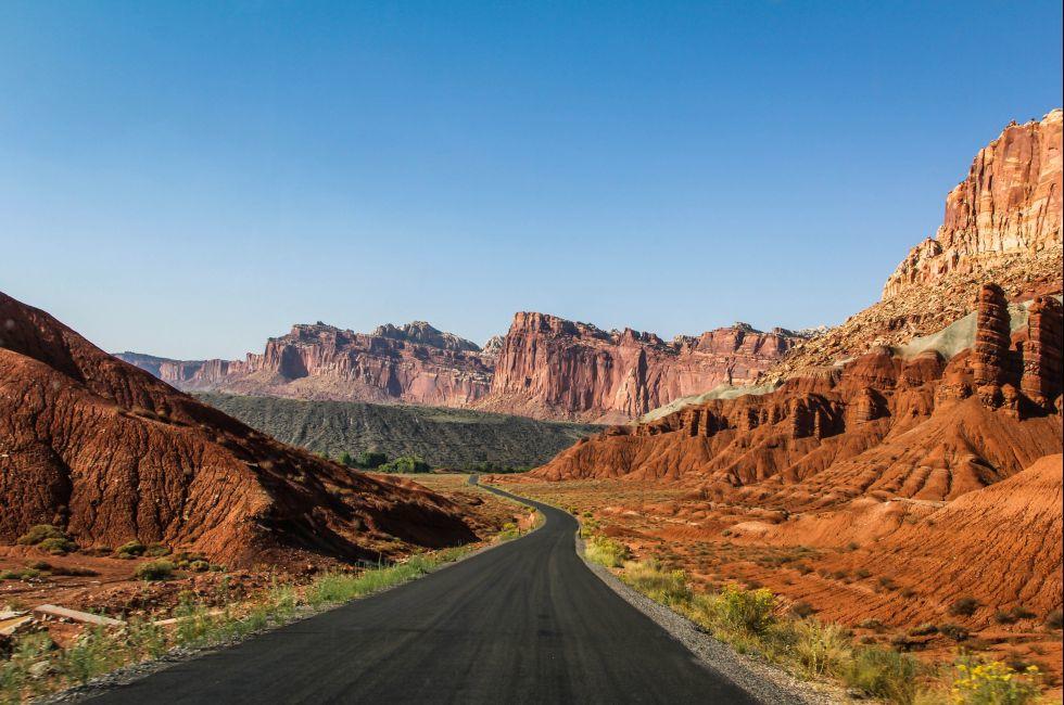 A road through Capitol Reef National Park / Capitol Reef Road / A road cuts through the mountains at Capitol Reef National Park, Utah.