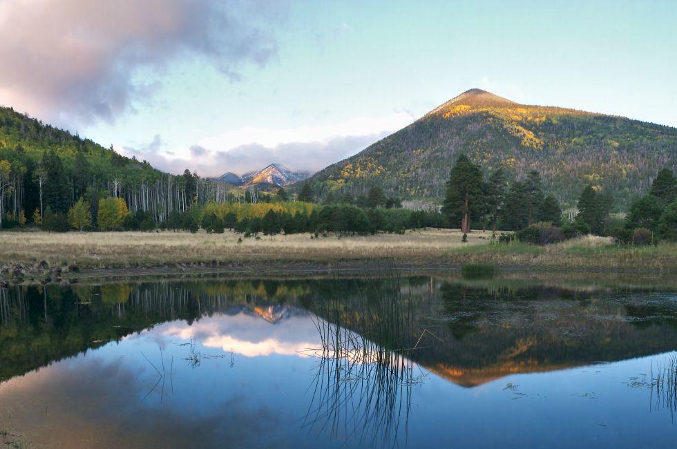 Lockett Meadow in autumn with San Francisco Peaks shrouded in clouds after snow storm.