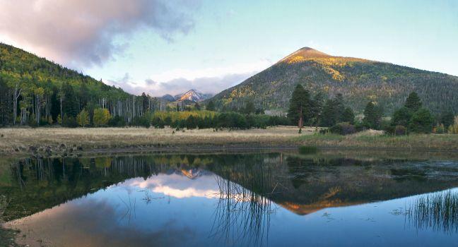 Lockett Meadow in autumn with San Francisco Peaks shrouded in clouds after snow storm.