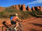 an Asian woman mountain biking along a dirt road near Sedona Arizona; Shutterstock ID 28517962; Project/Title: Fodors; Downloader: Melanie Marin