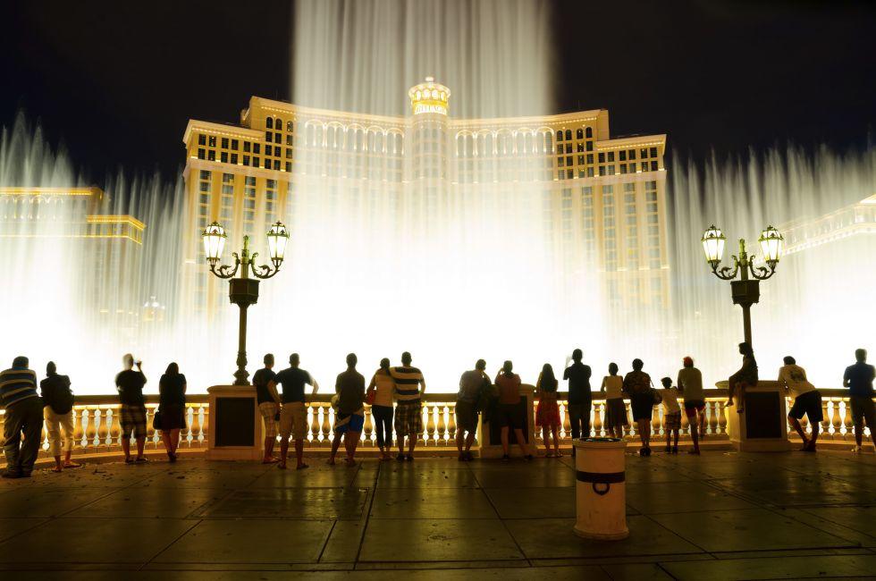 LAS VEGAS - AUGUST 12: Musical fountains at Bellagio Hotel & Casino on August 12, 2012 in Las Vegas. The Bellagio opened October 15, 1998, it was the most expensive hotel ever built at US$1.6 bn.; Shutterstock ID 118422310; Project/Title: City Apps; Do