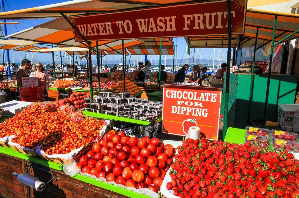 Summer crowds check out the fresh fruit and other items available at the Farmer's Market on Pier 39, located at the edge of famous Fisherman’s Wharf and the Embarcadero along San Francisco’s historic waterfront. Hugely popular, it is one of t