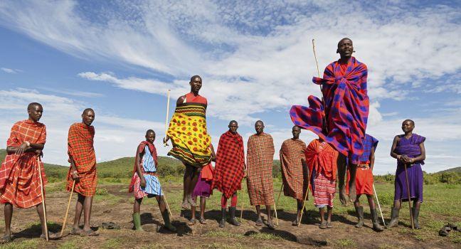 MASAI MARA, KENYA - DECEMBER 2: Unidentified Masai warriors dance and participate in traditional jumps as part of a cultural ceremony on December 2, 2011 in Masai Mara National Park, Masai Mara, Kenya