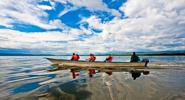 LAKE NAIVASHA, KENYA- OCTOBER 16: Tourists taking a boat trip on October 16, 2012 on Lake Naivasha, Kenya. Lake Naivasha is popular with both foreign and domestic tourists.