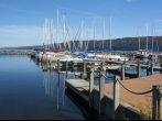 Sail boats at the boat marina at the southern end of Seneca lake in Watkins Glen New York on a beautiful blue sky day in autumn.