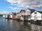 A row of boat houses on Canandaigua Lake in the Finger Lakes region of New York. Boathouses on Canandaigua Lake, New York