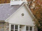 Front view of stone building in autumn in Chester, VT
