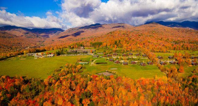 Aerial view of fall foliage including Trapp Family Lodge, Stowe, Vermont, USA