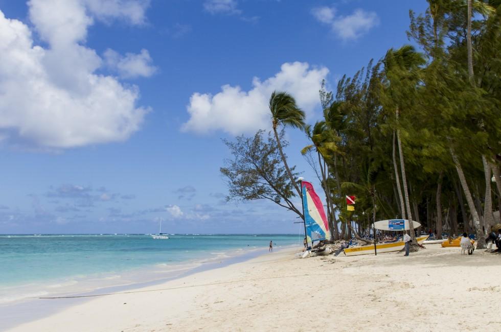 BAVARO, DOMINICAN REPUBLIC - APRIL 27: Unidentified tourists at the beach in Bavaro on April 27, 2013. Bavaro was developed together with the tourist region of Punta Cana, as a town for resort workers.