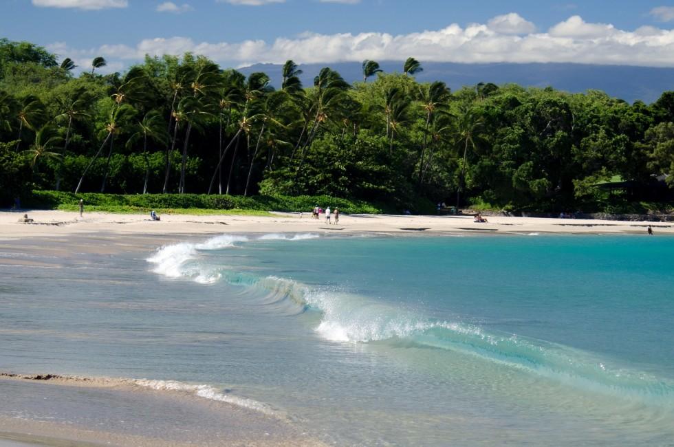Short surf wave at Mauna Kea beach, Big Island, Hawaii.