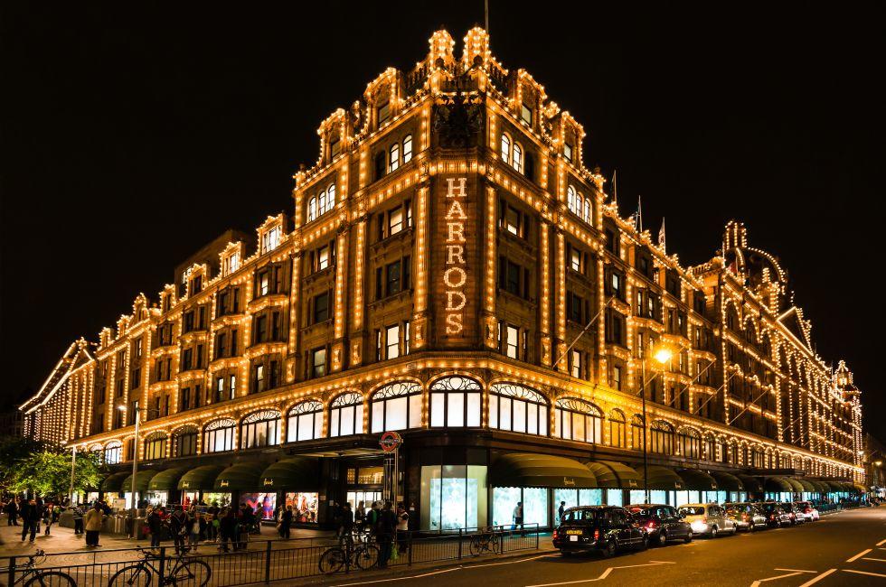 LONDON, UK - SEPTEMBER 25, 2014: The famous Harrods department store in the evening of September 25, 2014 at Knightsbridge in London, UK. Harrods is the biggest department store in Europe and offers