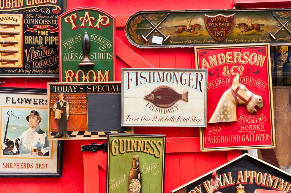 Vintage wooden signs on display in Portobello Market.
