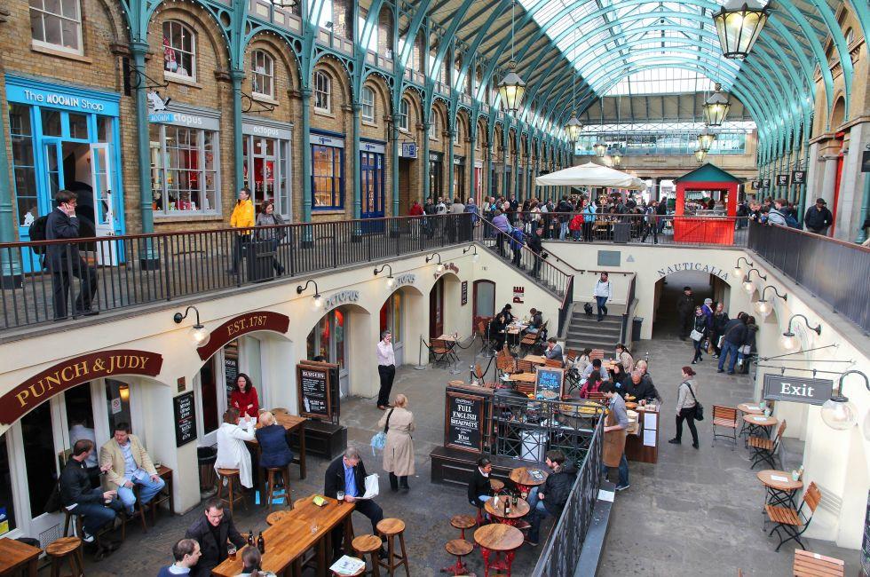LONDON - MAY 15: Tourists visit Apple Market on May 15, 2012 in Covent Garden, London. According to TripAdvisor, Camden Town currently is one of top 5 shopping destinations in London.
