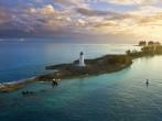nassau bahamas, lighthouse, and paradise island at dawn.