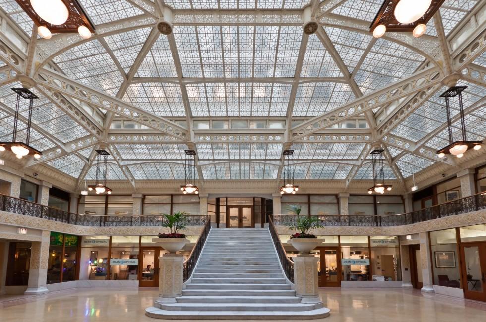 The main lobby of the Rookery building with its glass ceiling and amazing stairs. Chicago downtown, Illinois, United States.