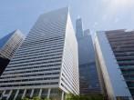 The Willis Tower (formerly Sears Tower) glass windows skyscraper in downtown Chicago, Illinois, United States. The EL mass transport system, pedestrians and cars on the street.
