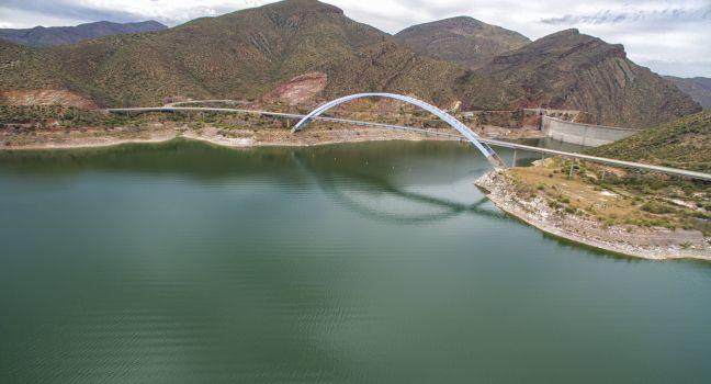 Panorama of Roosevelt Lake, bridge and Theodore Roosevelt Dam which are located at Apache trail scenic drive in Arizona, close to Phoenix. Picture was taken on 4th August, 2015.