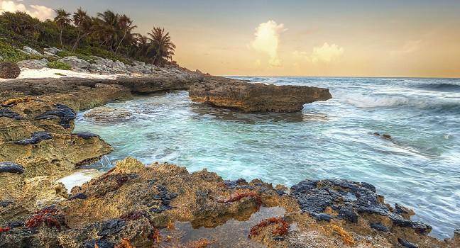 Caribbean beach in Mexico at sunset.