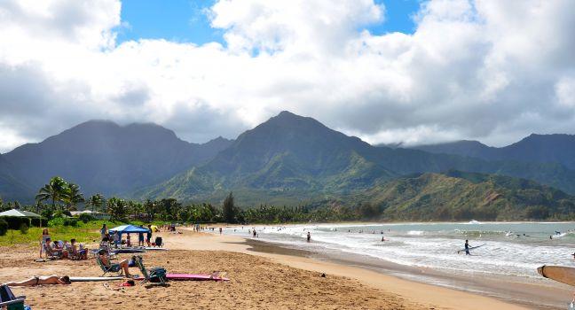 Hanalei Bay Beach in Kauai, Hawaii. A public beach where people go to swim and surf.