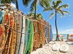 HONOLULU, HAWAII - SEPTEMBER 7, 2013: Surfboards lined up in the rack at famous Waikiki Beach in Honolulu. Oahu, Hawaii.