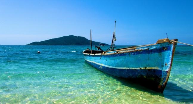Lone Boat on tropical paradise island Honduras caribbean; Shutterstock ID 70700359; Project/Title: SV_2014