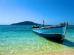 Lone Boat on tropical paradise island Honduras caribbean; Shutterstock ID 70700359; Project/Title: SV_2014