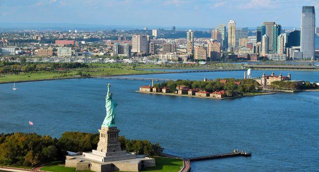 NEW YORK - OCT 15: Aerial view of the Statue of Liberty and Ellis Island on Oct 15 2010. From 1892 to 1954, over 12 million immigrants entered USA through the portal of Ellis Island in New York Harbor; Shutterstock ID 151423415; Project/Title: 10 Things NO